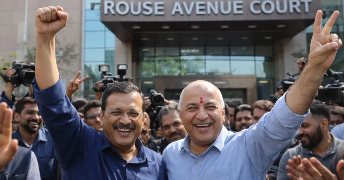 Arvind Kejriwal and Manish Sisodia outside Rouse Avenue Court after the landmark discharge order on February 27, 2026.